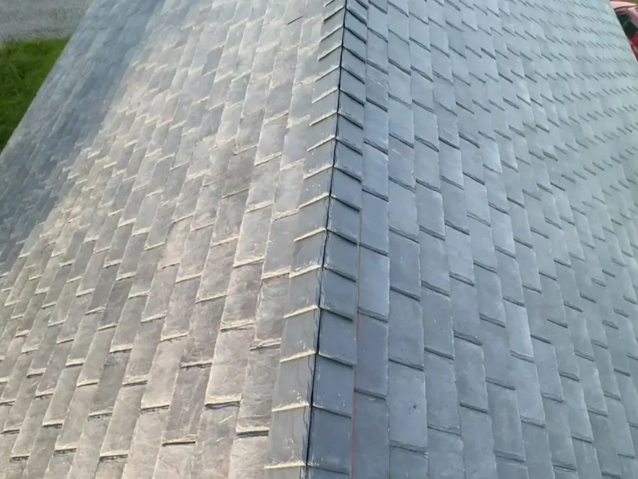 Close-up of a newly installed architectural asphalt shingle ridge cap.