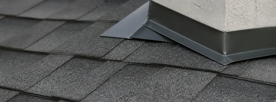 Close-up texture of flashing detail along a roof edge.