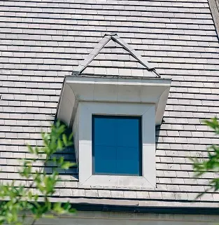 Clean grey tiles with a skylight after replacement.